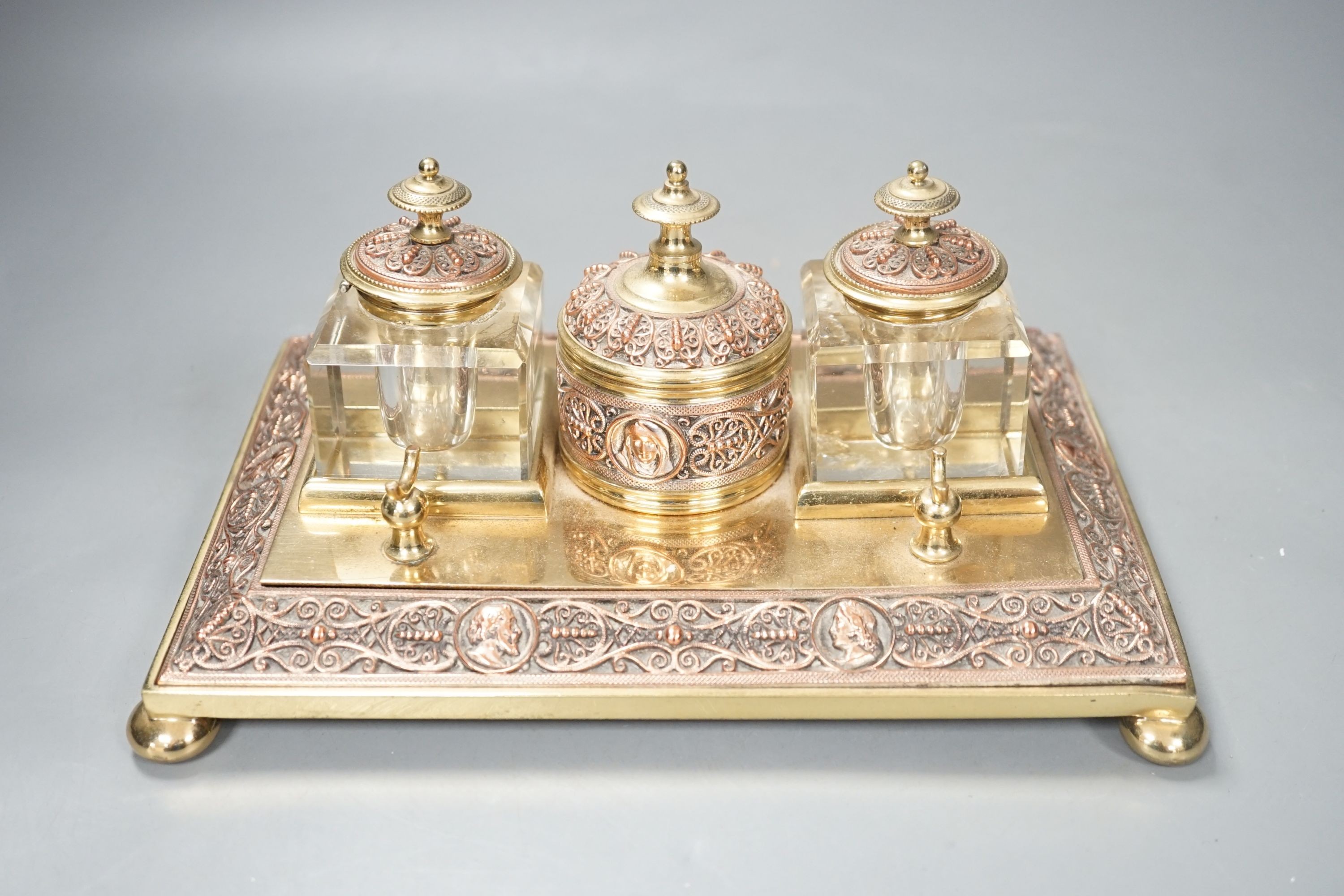 A 19th century copper and brass two bottle inkstand. Length 24cm